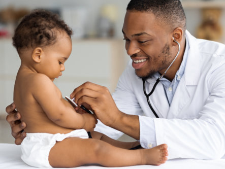 doctor checking a child using stethoscope