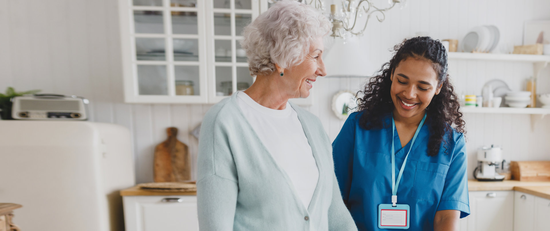 medical nurse volunteer helping senior female at home