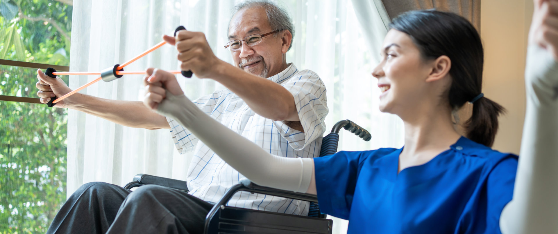 senior elderly man on wheelchair doing physiotherapist with support from therapist