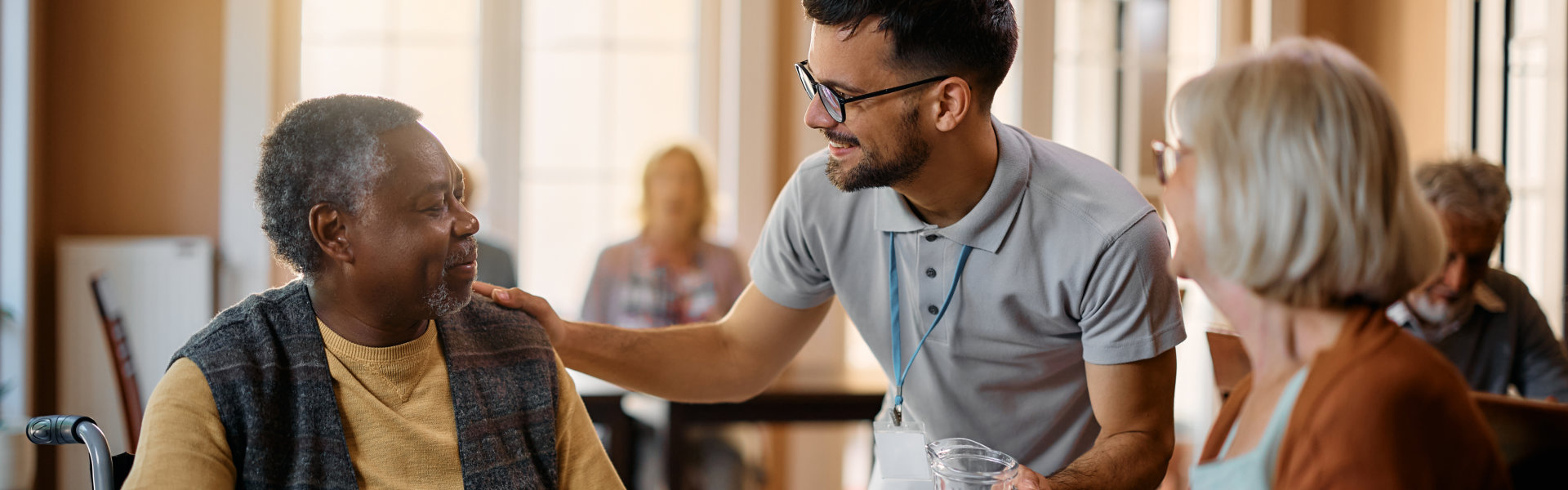 man assisting elderly people