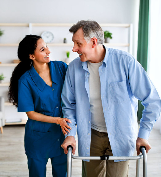 nurse assisting elderly man