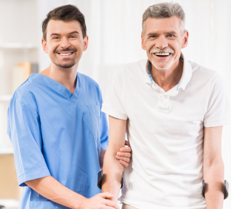 nurse and elderly man smiling