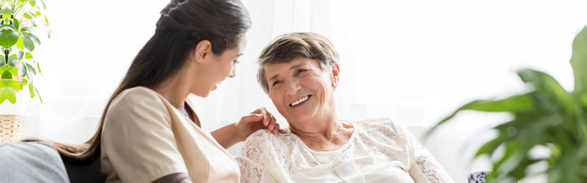 nurse and elderly woman talking